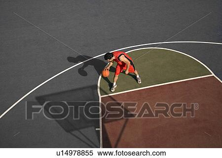 Man playing basketball View Large Photo Image Stock Photography - Man playing basketball. Fotosearch