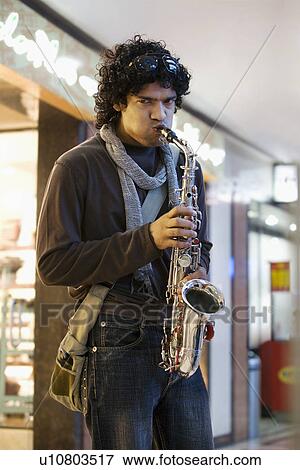 Stock Photo - Man playing the saxophone. Fotosearch