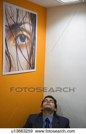 Stock Photo - Man sleeping in the office. Fotosearch