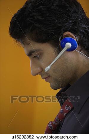 Man speaking on microphone View Large Photo Image Stock Image - Man speaking on microphone. Fotosearch
