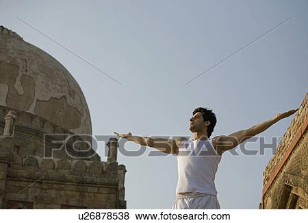 Man stretching out his arms View Large Photo Image Stock Photo - Man stretching out his arms. Fotosearch