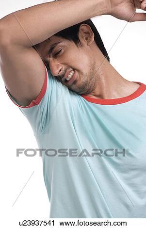Stock Image - Man sweating. Fotosearch