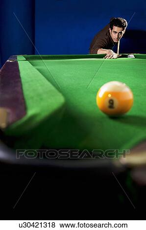 Stock Photo - Man taking a shot. Fotosearch