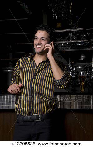 Stock Photograph - Man talking on his phone. Fotosearch