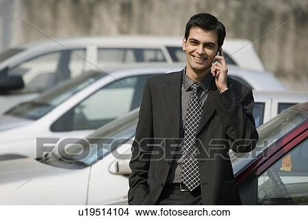 Man talking on the phone View Large Photo Image Picture - Man talking on the phone. Fotosearch