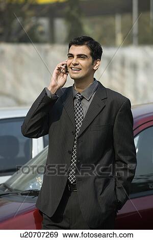 Stock Photo - Man talking on the phone. Fotosearch