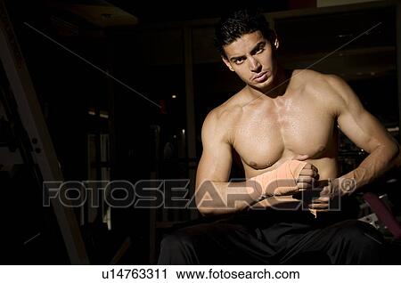 Man tying a bandage View Large Photo Image Stock Image - Man tying a bandage. Fotosearch
