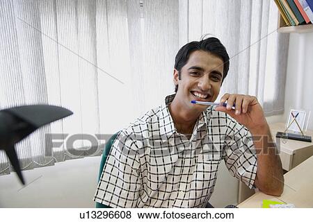 Man with a ballpoint pen View Large Photo Image Stock Photo - Man with a ballpoint pen. Fotosearch