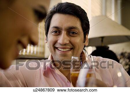 Man with a glass of wine View Large Photo Image Stock Photo - Man with a glass of wine. Fotosearch