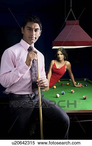 Man with cue stick posing View Large Photo Image Stock Photography - Man with cue stick posing. Fotosearch