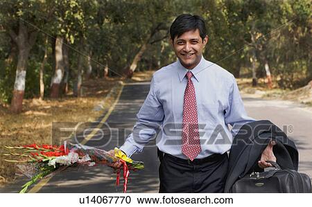 Man with flowers View Large Photo Image Stock Image - Man with flowers. Fotosearch