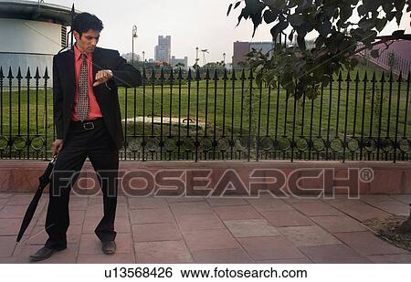 Man with umbrella View Large Photo Image Stock Photograph - Man with umbrella. Fotosearch