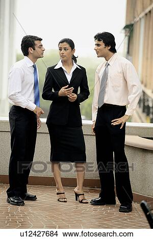 Men and woman in a meeting View Large Photo Image Picture - Men and woman in a meeting. Fotosearch