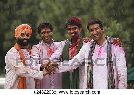 Stock Photography - Men celebrating Holi. Fotosearch