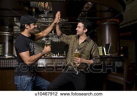 Stock Image - Men enjoying themselves. Fotosearch