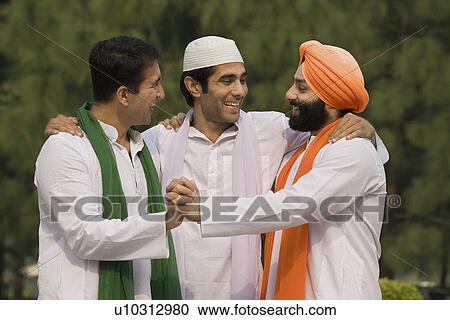Stock Image - Men joining hands together. Fotosearch