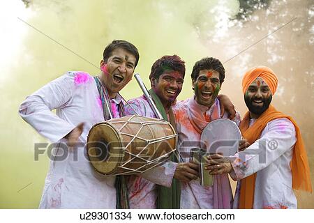 Picture - Men playing Holi. Fotosearch