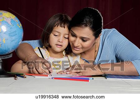 Stock Photo - Mother and daughter colouring. Fotosearch
