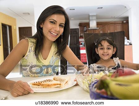 Mother and daughter having breakfast View Large Photo Image Stock Image - Mother and daughter having breakfast. Fotosearch