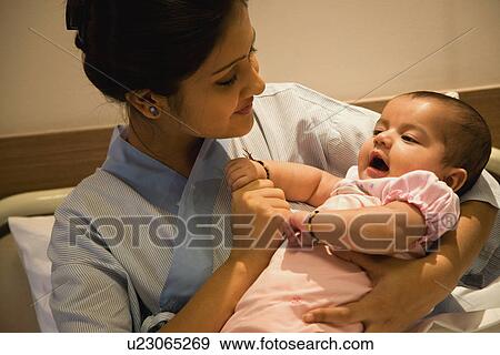 Mother with her baby View Large Photo Image Stock Photo - Mother with her baby. Fotosearch