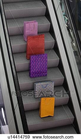Paper bags on escalator View Large Photo Image Stock Photo - Paper bags on escalator. Fotosearch