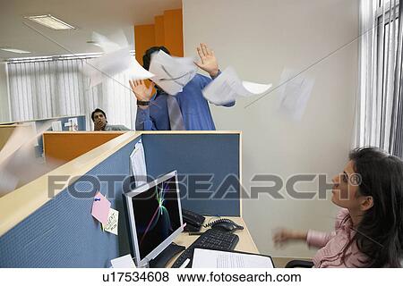 Papers flying around in an office View Large Photo Image Stock Photo - Papers flying around in an office. Fotosearch