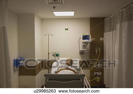 Stock Image - Patient resting in the hospital. Fotosearch
