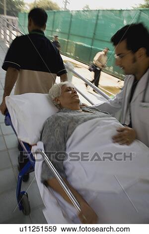 Stock Photo - Patient rushed to the ER. Fotosearch