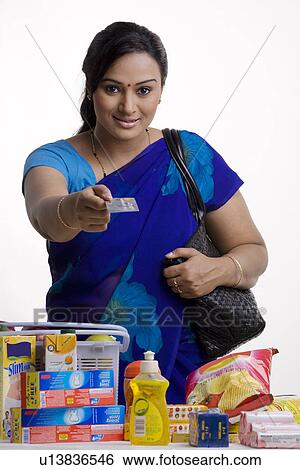 Stock Photograph - Paying by credit card. Fotosearch