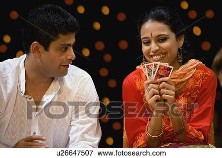 Stock Photo - People playing cards. Fotosearch