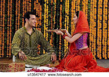 Stock Photo - Performing a pooja. Fotosearch