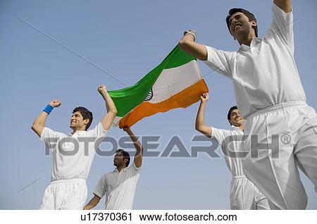 Stock Image - Players holding the national flag. Fotosearch