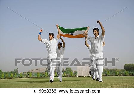 Stock Photograph - Players holding the national flag. Fotosearch