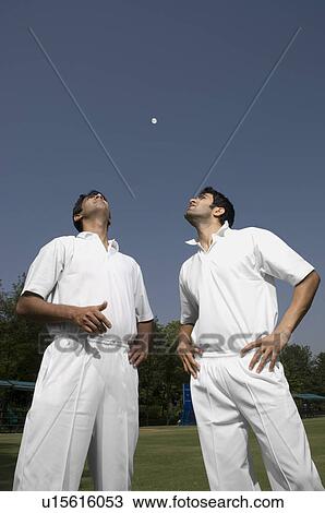 Stock Image - Players tossing a coin. Fotosearch