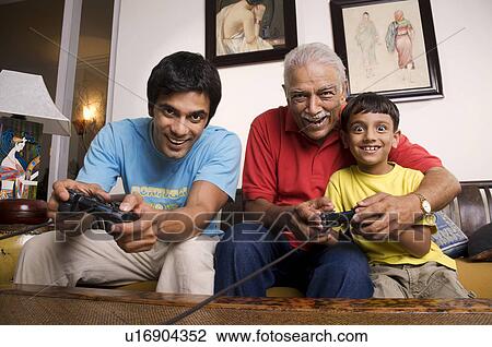 Playing video games View Large Photo Image Stock Image - Playing video games. Fotosearch