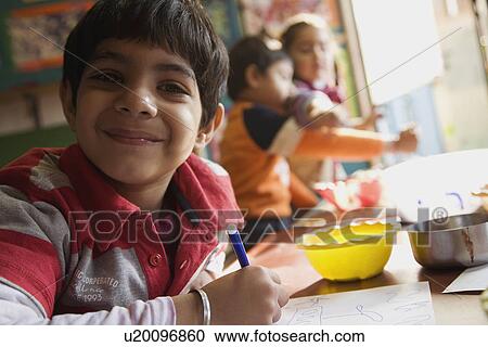Stock Image - Portrait of young boy. Fotosearch