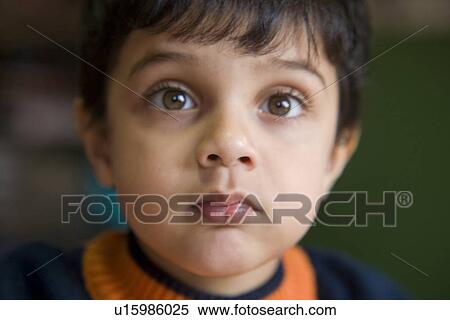 Stock Photography - Portrait of young boy. Fotosearch