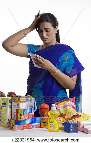 Picture - Reacting to the huge bill. Fotosearch