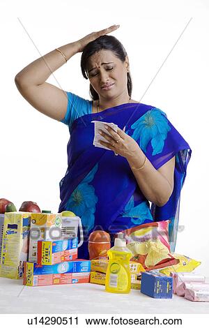 Stock Image - Reacting to the huge bill. Fotosearch