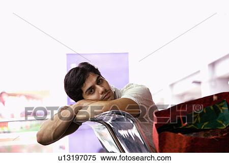 Relaxing on a bench View Large Photo Image Stock Photography - Relaxing on a bench. Fotosearch