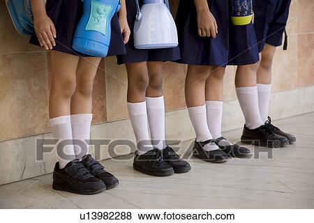 School children standing in a row View Large Photo Image Stock Photo - School children standing in a row. Fotosearch
