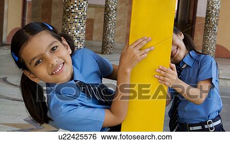 Stock Photograph - School girls playing. Fotosearch