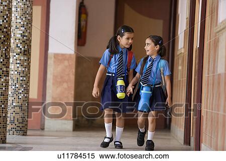 School girls walking together View Large Photo Image Stock Photography - School girls walking together. Fotosearch