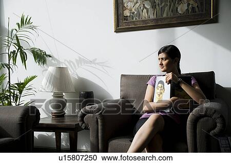 Secretary holding a book View Large Photo Image Stock Image - Secretary holding a book. Fotosearch