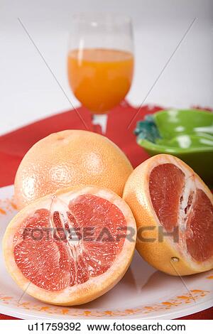 Sliced oranges with a glass of juice View Large Photo Image Stock Image - Sliced oranges with a glass of juice. Fotosearch