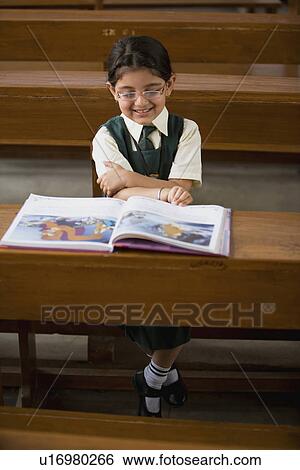 Stock Photograph - Student reading a book. Fotosearch