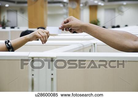 Stock Photography - Students exchanging a note. Fotosearch