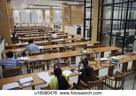 Stock Photograph - Students in a college library. Fotosearch