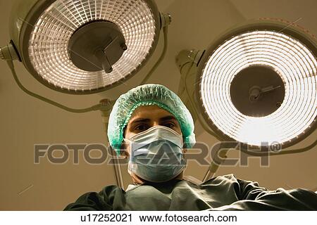 Surgeon in the operation theatre View Large Photo Image Stock Image - Surgeon in the operation theatre. Fotosearch