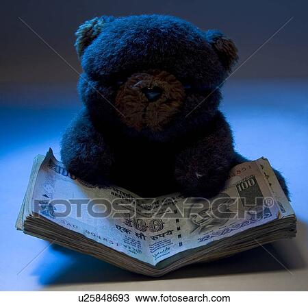 Stock Image - Teddy bear with money. Fotosearch